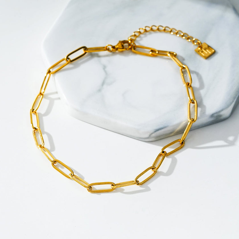 HAKILA LG : Bracelet de cheville en chaîne d'anneaux d'acier doré essentiel