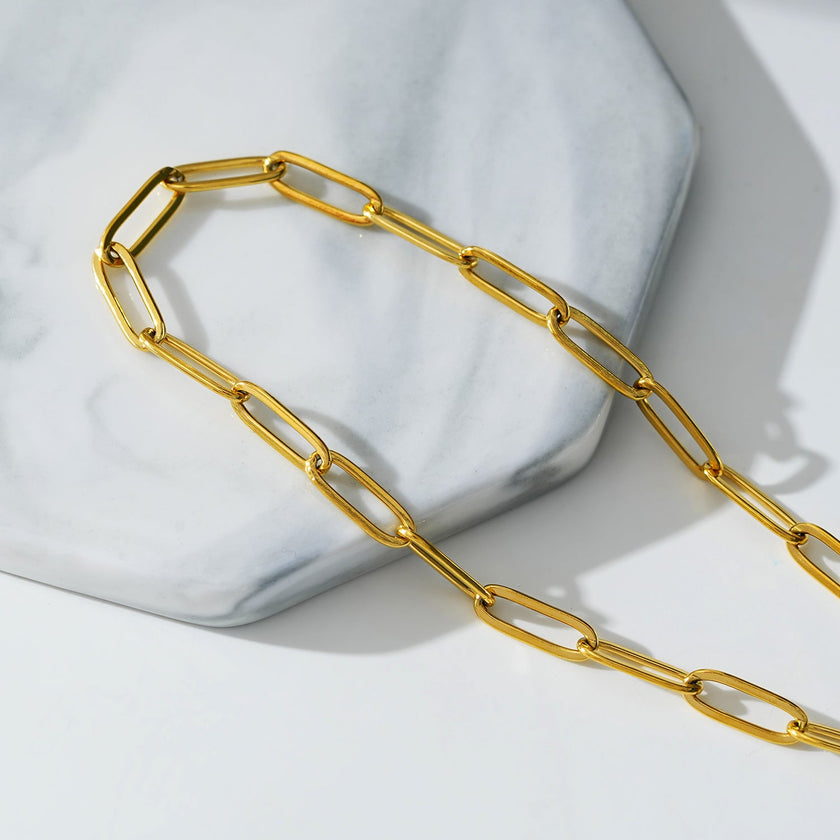 HAKILA LG : Bracelet de cheville en chaîne d'anneaux d'acier doré essentiel