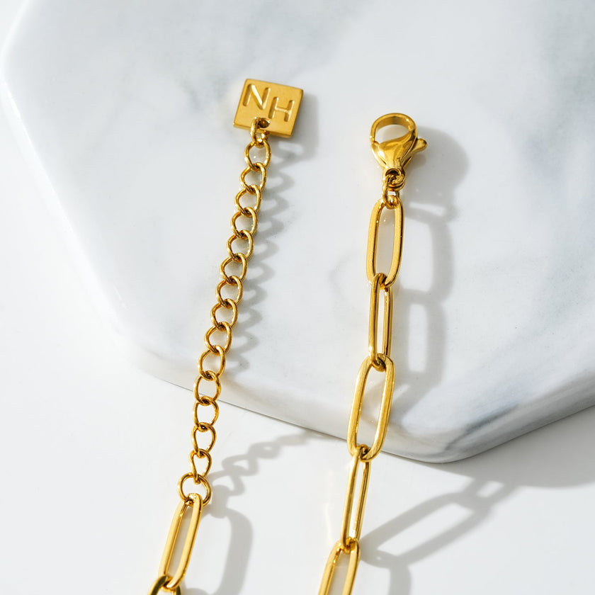 HAKILA LG : Bracelet de cheville en chaîne d'anneaux d'acier doré essentiel