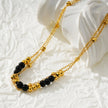 HILDA LG : Bracelet de cheville 2-en-1 avec perles carrées et perles rondes, noir et or.