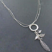 Beaten Ring Necklace With Leaf Charms In Silver Plate