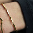 Bracelet en chaîne Style ITARSI Gold : Design minimaliste et géométrique avec perles.