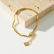 Bracelet en chaîne Style ITARSI Gold : Design minimaliste et géométrique avec perles.