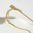 JASPUR : Collier serpentin avec pendentif nœud d'amour en or.