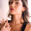 JASPUR : Collier serpentin avec pendentif nœud d'amour en or.