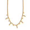 Style KALPI : Collier en chaîne à perles et zircons dorés.