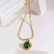 KRISTOS: Vintage Inspired Snake Skin Chain anchoring a Malachite Oval Pendant