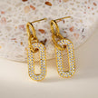LAIA : Boucles d'oreilles rectangulaires arrondies serties de pierres précieuses en zircone.