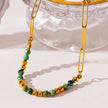LAIMA : Collier chaîne à maillons en papier doré et pierres de turquoise africaine.