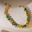 LAIMA : Collier chaîne à maillons en papier doré et pierres de turquoise africaine.