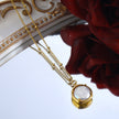 LERATI : Chaîne perlée avec pendentif en perle d'eau douce encapsulée en or.