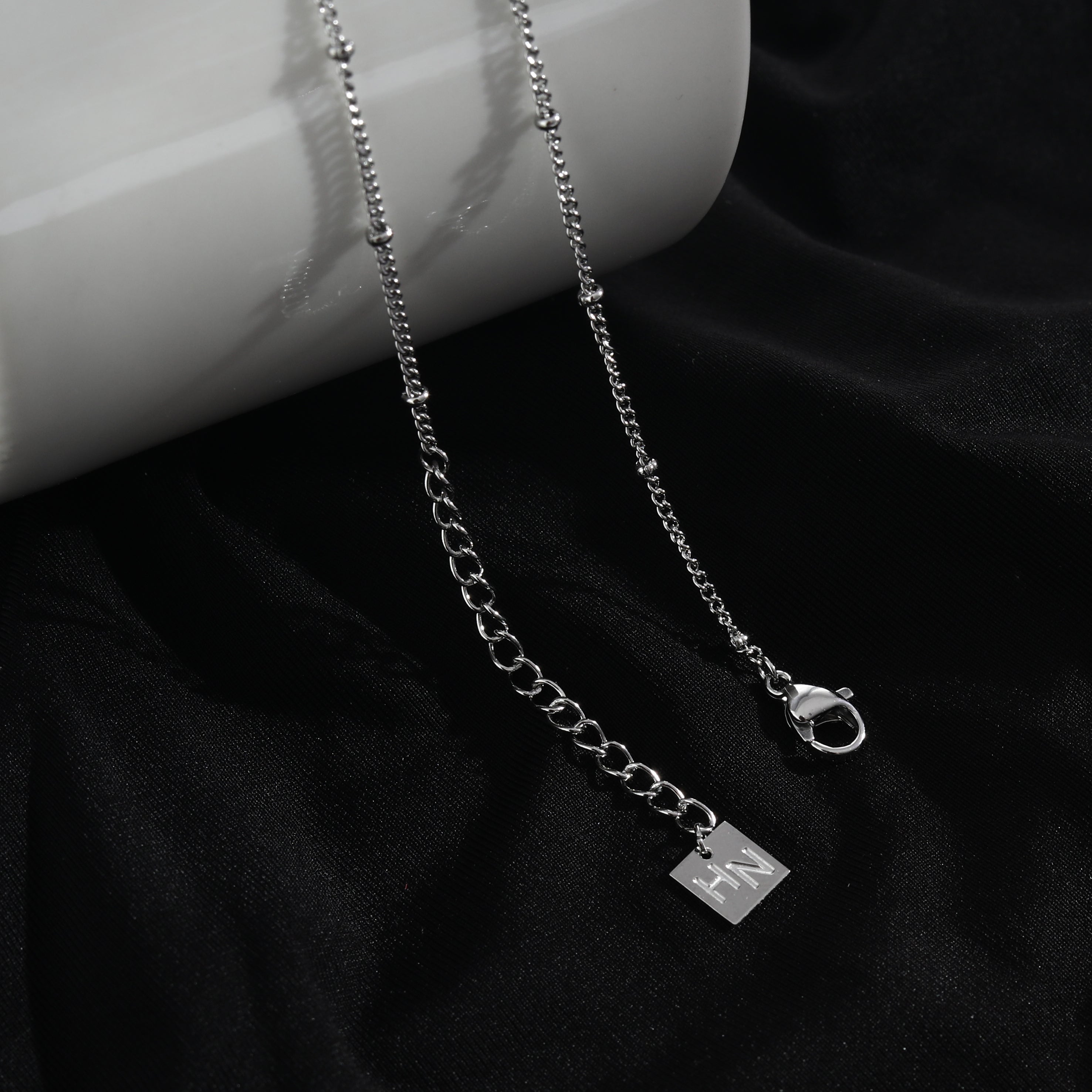 LERATI Beaded Chain with an Encased Fresh Water Pearl Pendant in Silver
