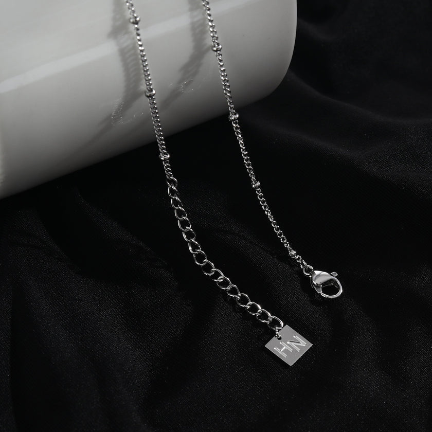 LERATI Beaded Chain with an Encased Fresh Water Pearl Pendant in Silver