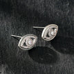 Boucles d'oreilles Lucky Eye en or blanc (ton argenté) : boucles d'oreilles œil maléfique ornées de zircone (CZ).