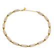 LULAMA : Collier bohème moderne en chaîne avec pierres de turquoise blanche et perles dorées.