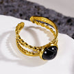 MALAYA : Bague à plusieurs anneaux entrelacés avec une pierre centrale de turquoise noire.