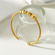 Style MALDONA: Industrial-Chic Bracelet with Round & Square Beads in Gold