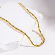 Style MILLIE : Collier en chaîne dorée à double perles.