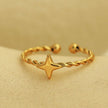 NICOLE Gold: Textured Ring with a Four Point Star Centre Piece