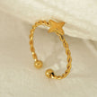 NICOLE Gold: Textured Ring with a Four Point Star Centre Piece