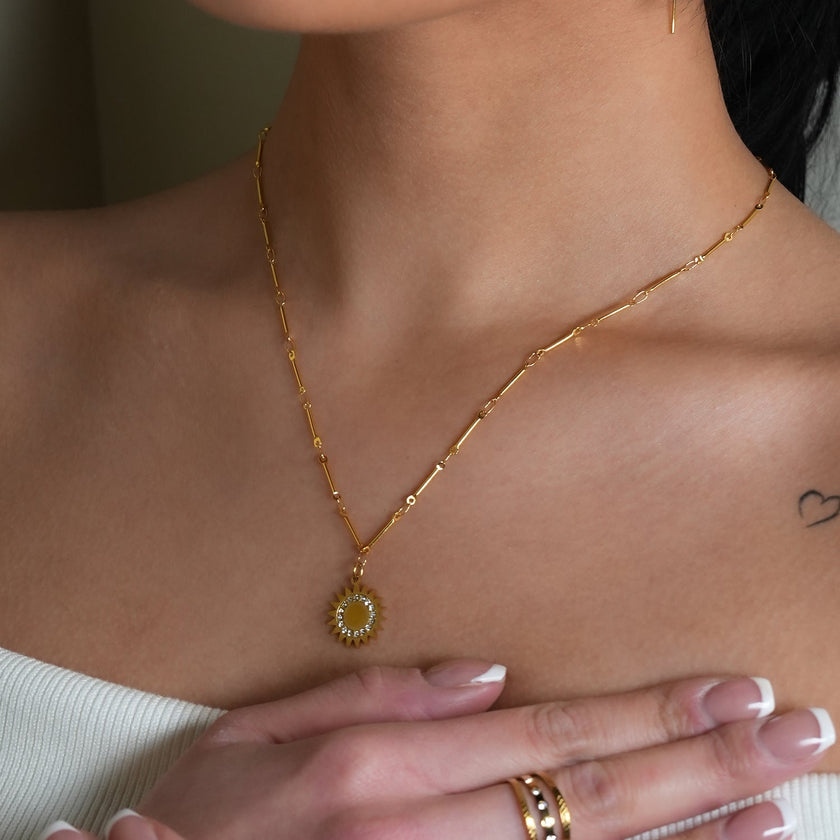 NOMIA Gold: Radiant Sunburst Pendant Zirconia Chain Necklace