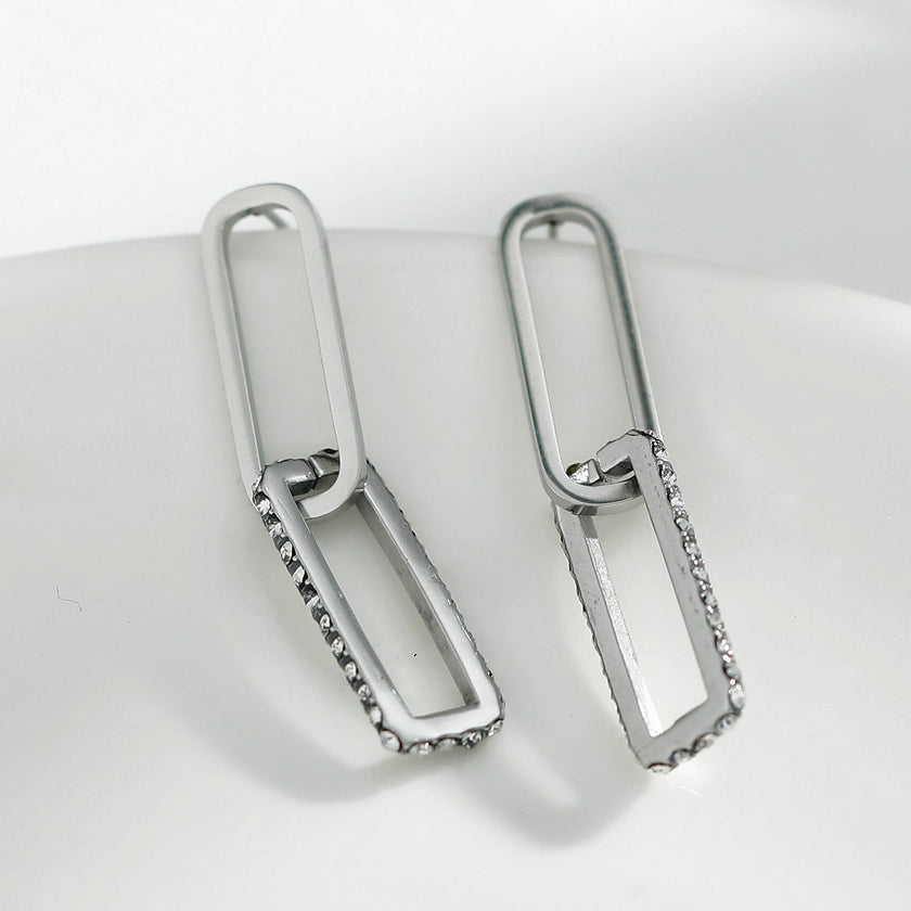 Boucles d'oreilles argentées LUCIANA, double agrafe, pavé de zircons.