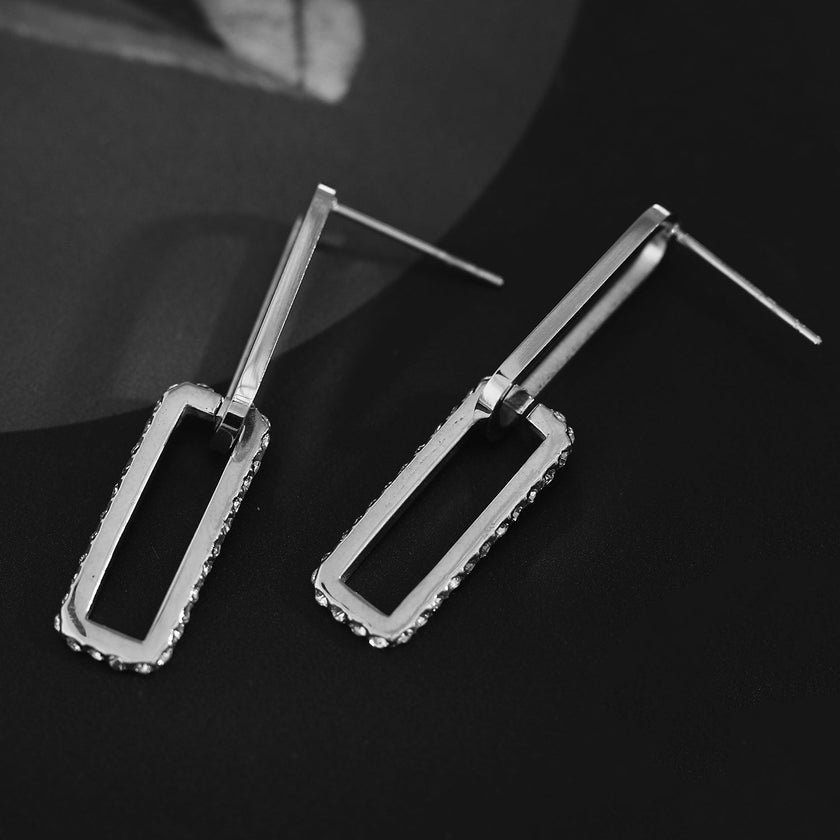 Boucles d'oreilles argentées LUCIANA, double agrafe, pavé de zircons.