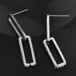 Boucles d'oreilles argentées LUCIANA, double agrafe, pavé de zircons.