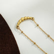 Chaîne dorée perlée KIMI avec pendentif en zircone pavé délicat.