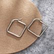 Boucles d'oreilles carrées REILYNN. En or et argent.
