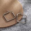 Boucles d'oreilles carrées REILYNN. En or et argent.