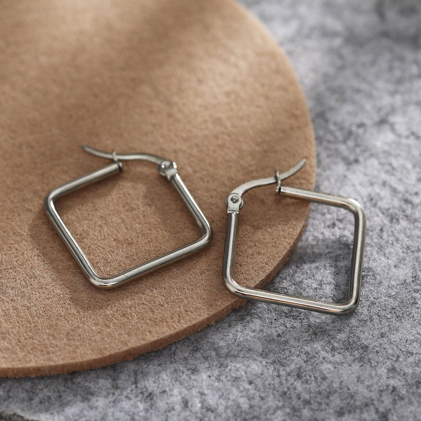Boucles d'oreilles carrées REILYNN. En or et argent.