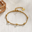 AMIENS Gold : Bracelet en cordelette perlée