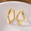 ALMA: Twisted Diamond Shaped Hoop Earrings Embedded with Zirconia Gemstones