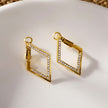 ALMA: Twisted Diamond Shaped Hoop Earrings Embedded with Zirconia Gemstones