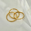 ESTELLA : Bague en or à trois anneaux entrelacés.