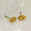 TINDRA : Boucles d'oreilles en forme d'ovale en or avec un zircon solitaire.