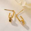 ARETE : Timeless Romance - Boucles d'oreilles en forme de trombone avec pierres précieuses en forme de cœur