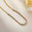 MESTIA : Collier combiné avec chaînes à texture peau de serpent et chaînes tennis.