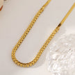 MESTIA : Collier combiné avec chaînes à texture peau de serpent et chaînes tennis.