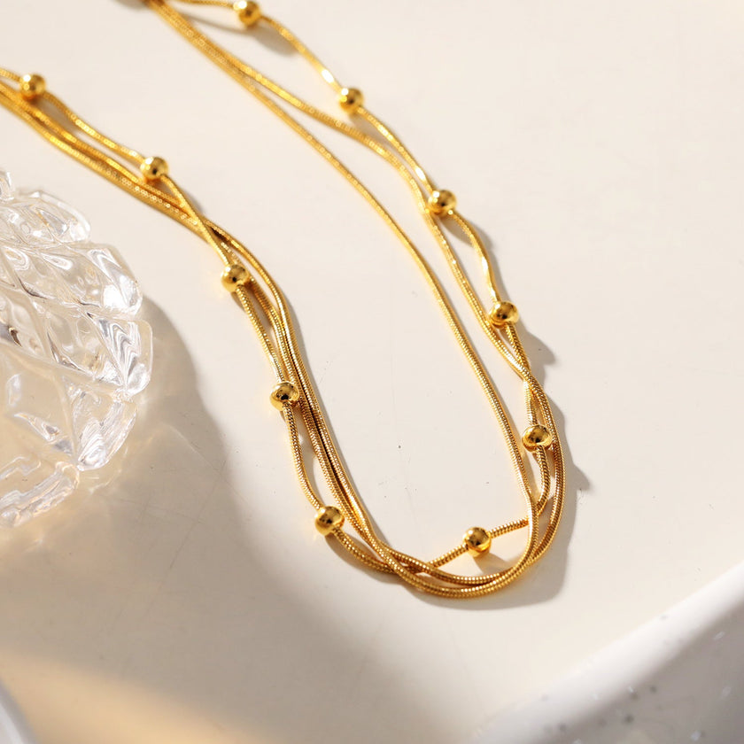 KAKIA: Triple Snake-Skin Chain Layered Necklace with Ball-Bead Accents