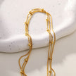 KAKIA: Triple Snake-Skin Chain Layered Necklace with Ball-Bead Accents