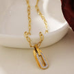 CHICALA : Collier avec pendentif en forme d'ovale serti de zircons, sur chaîne à maillons plats.
