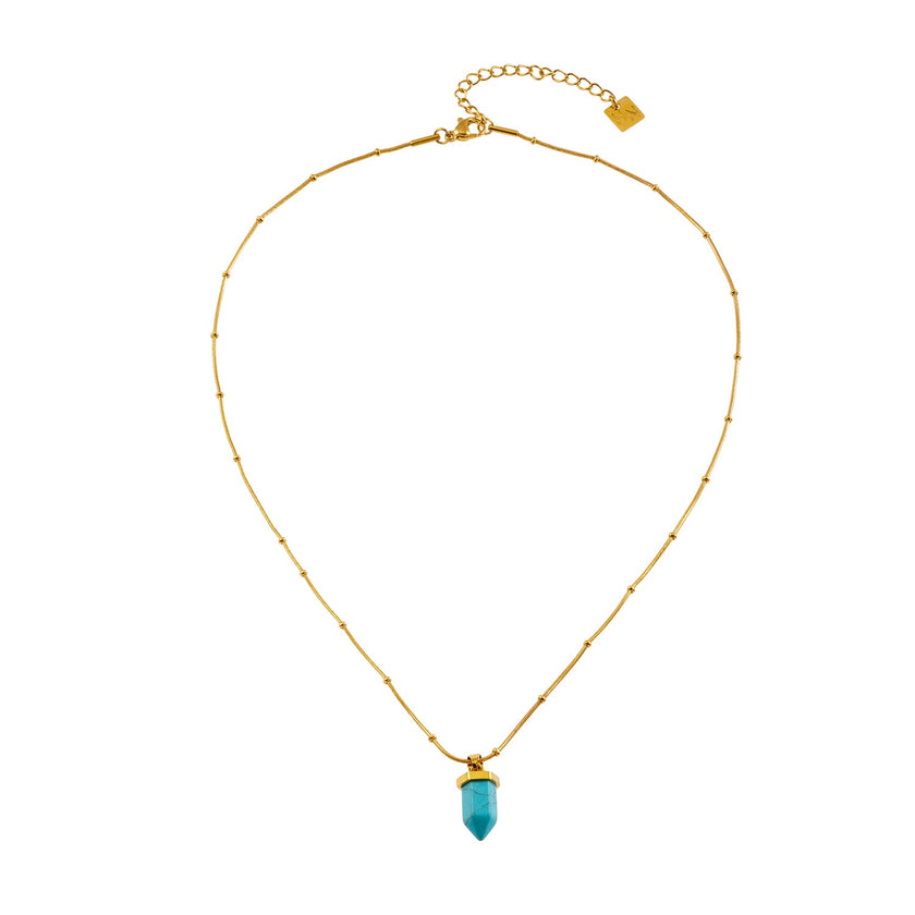 PIPPI : Collier avec pendentif en pierre turquoise africaine, suspendu à une chaîne perlée texturée imitant la peau de serpent.