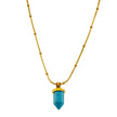 PIPPI : Collier avec pendentif en pierre turquoise africaine, suspendu à une chaîne perlée texturée imitant la peau de serpent.