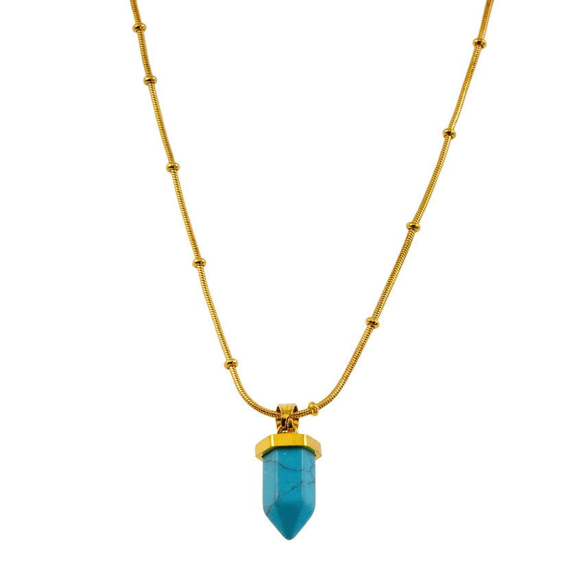 PIPPI : Collier avec pendentif en pierre turquoise africaine, suspendu à une chaîne perlée texturée imitant la peau de serpent.