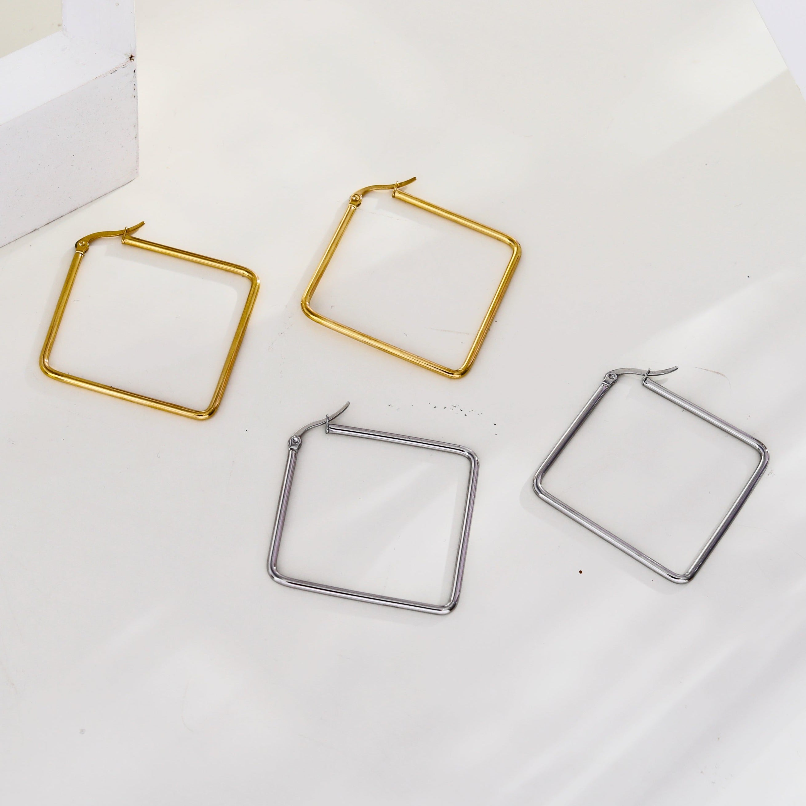 REILYNN: Square Silver Hoops - A Bold Twist on Classic Elegance