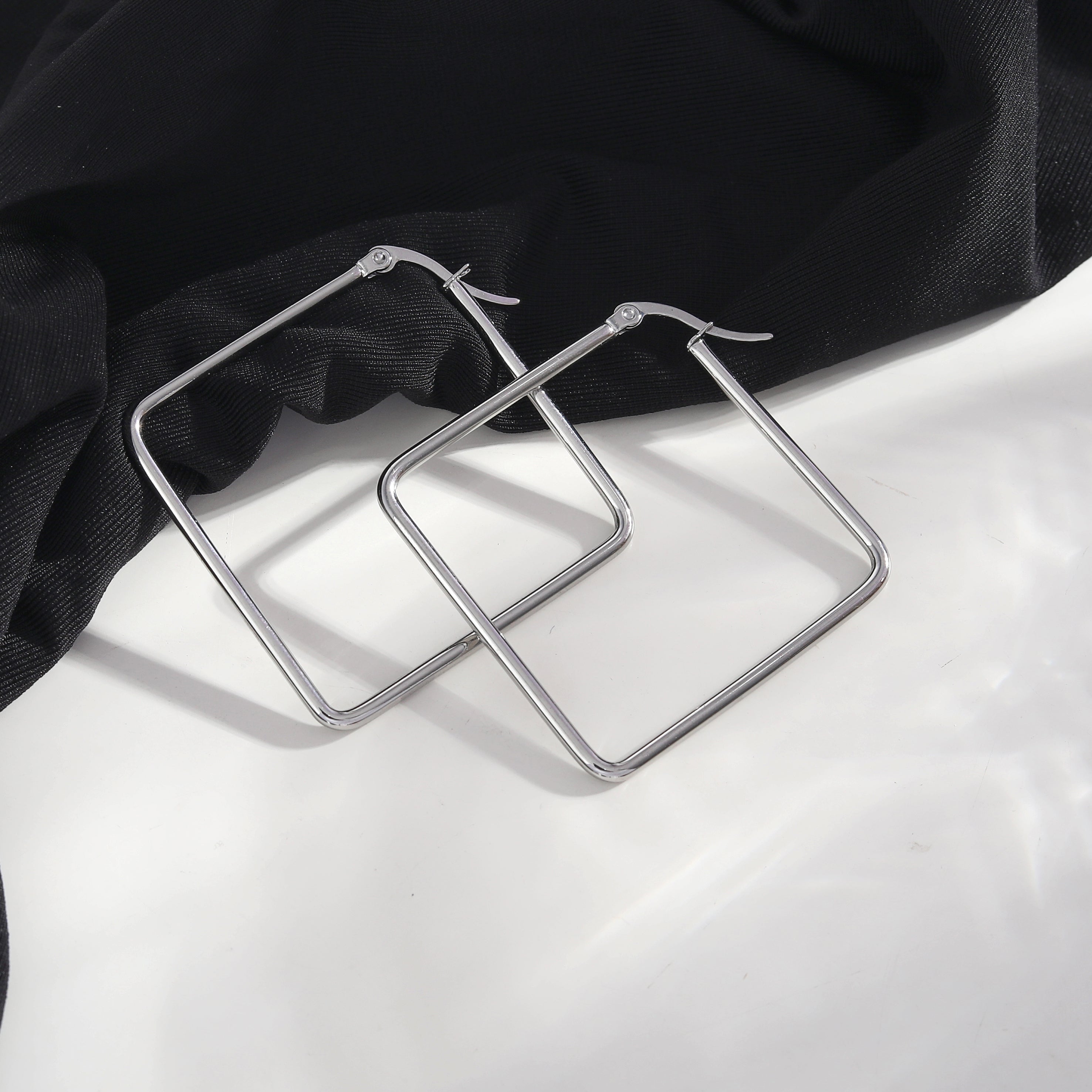 REILYNN: Square Silver Hoops - A Bold Twist on Classic Elegance