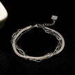 REINEDA: Triple Stacked White Gold (Silver Toned) Bracelet