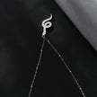 Collier RIHANNA à chaîne perlée avec pendentif serpent en zircone pavée, en argent.